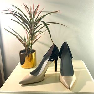 Calvin Klein pump. Color bone leather, black suede. Only worn ONCE! Great shoe!